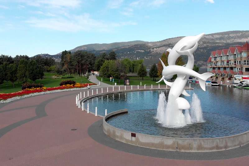 view of a fountain with a dolphin statue